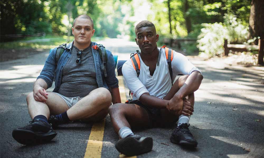 Friends on Lying on Road Shot